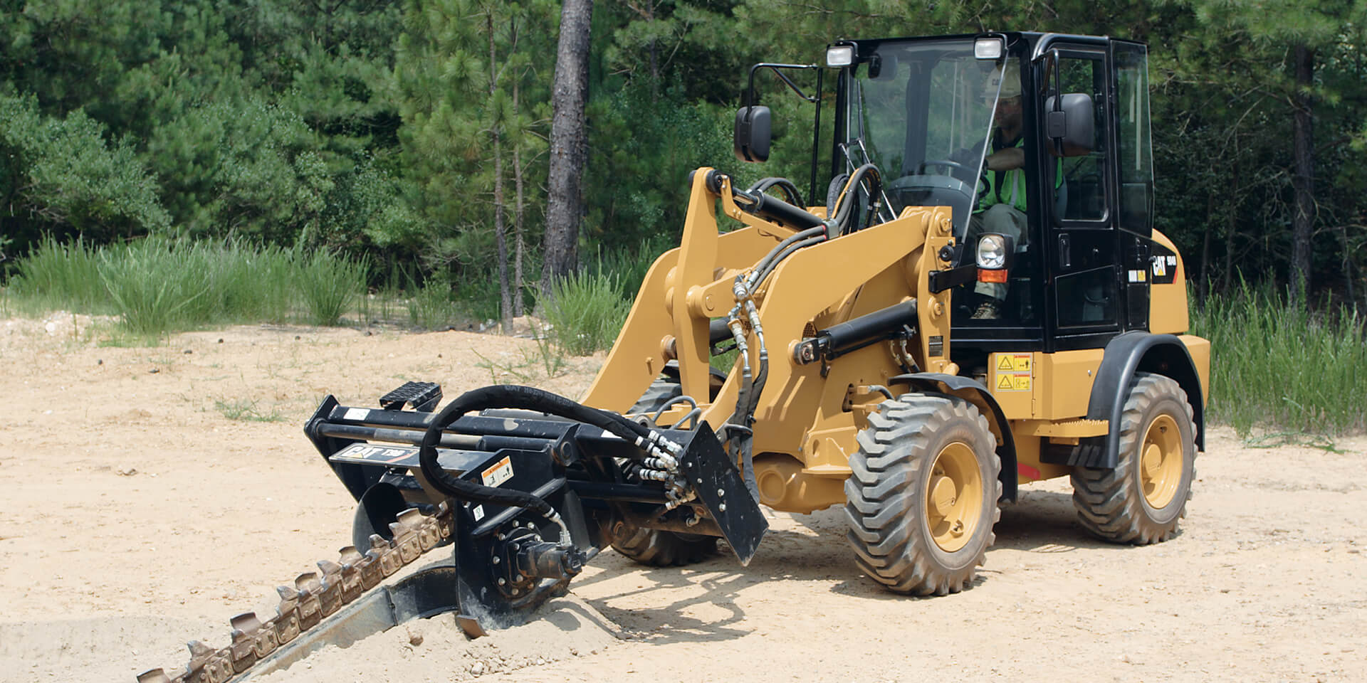 Cat Loader with Trenching attachment